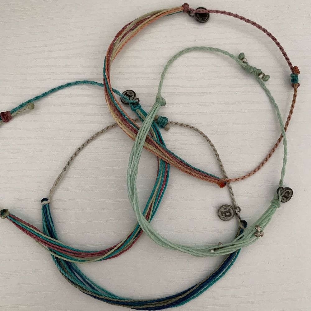 Pura Vida bracelets, four bracelets, barely used, multicolored.